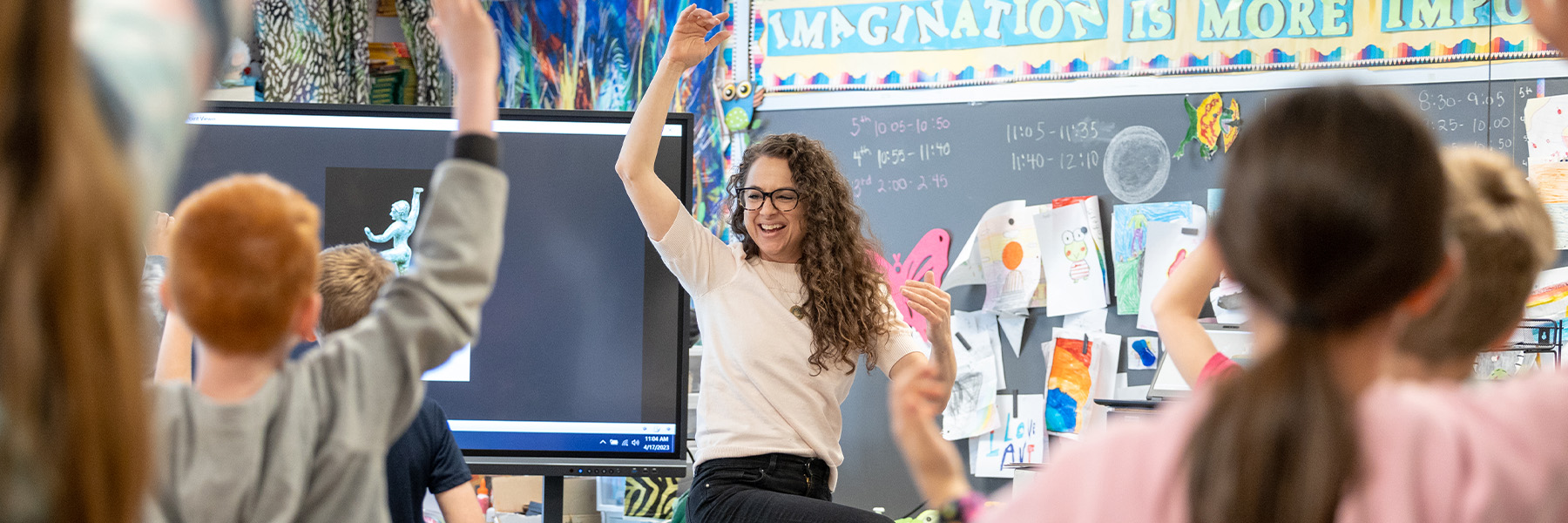 A teacher engages her young students in her classroom