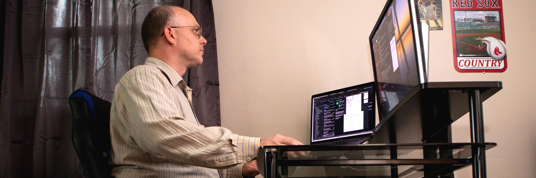 A man works at his remote home office